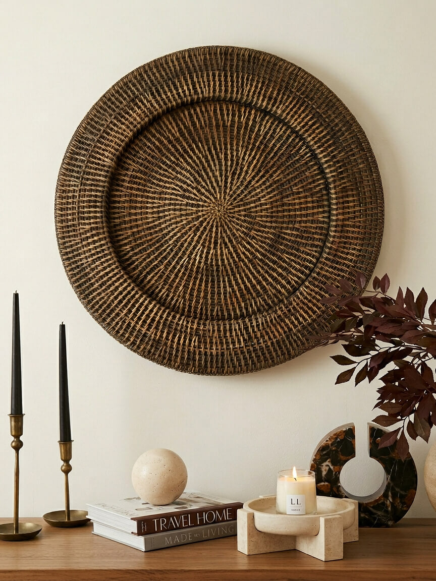 Ratho small antique brown rattan wall hanging displayed above wooden cabinet with stone bowl and neutral décor