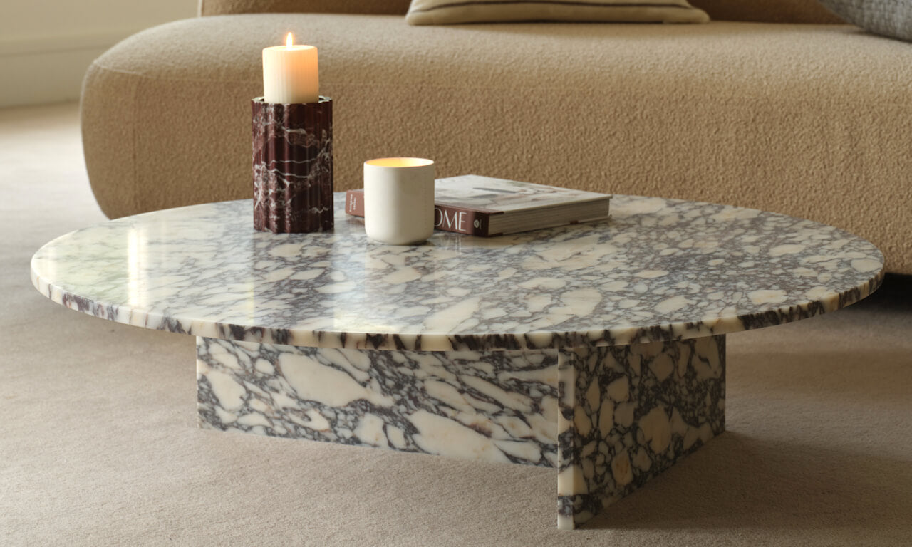 Layered Lounge marble coffee table showing natural veining in a warm interior