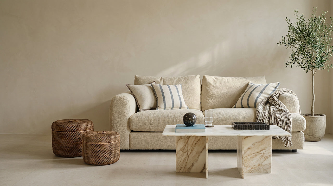 Warm, layered living room styled with rattan and natural materials