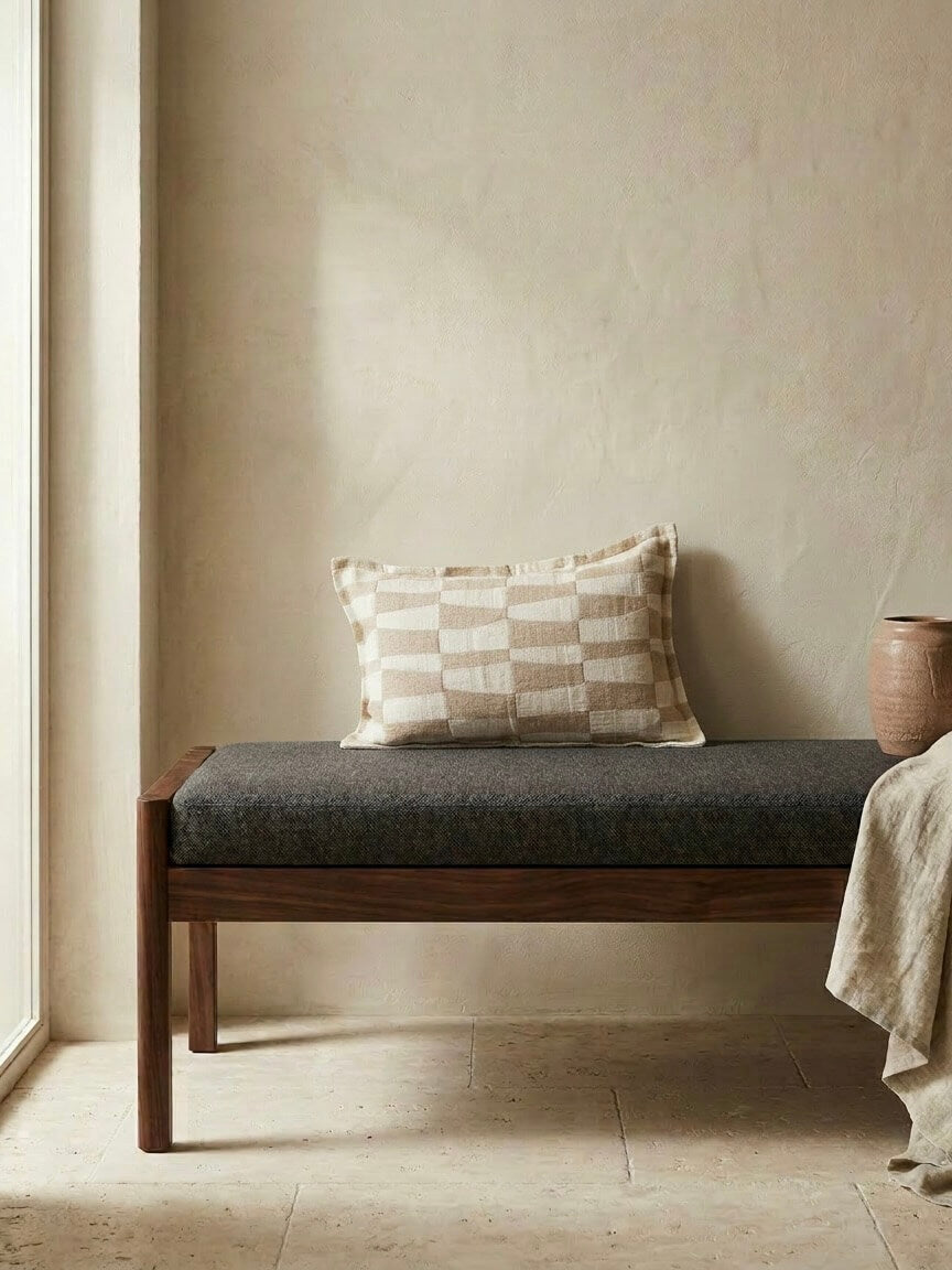 Caramel pattern rectangular cushion 30x50 cm with neutral checkered design on a wooden bench, styled in a warm minimalist interior with soft natural tones