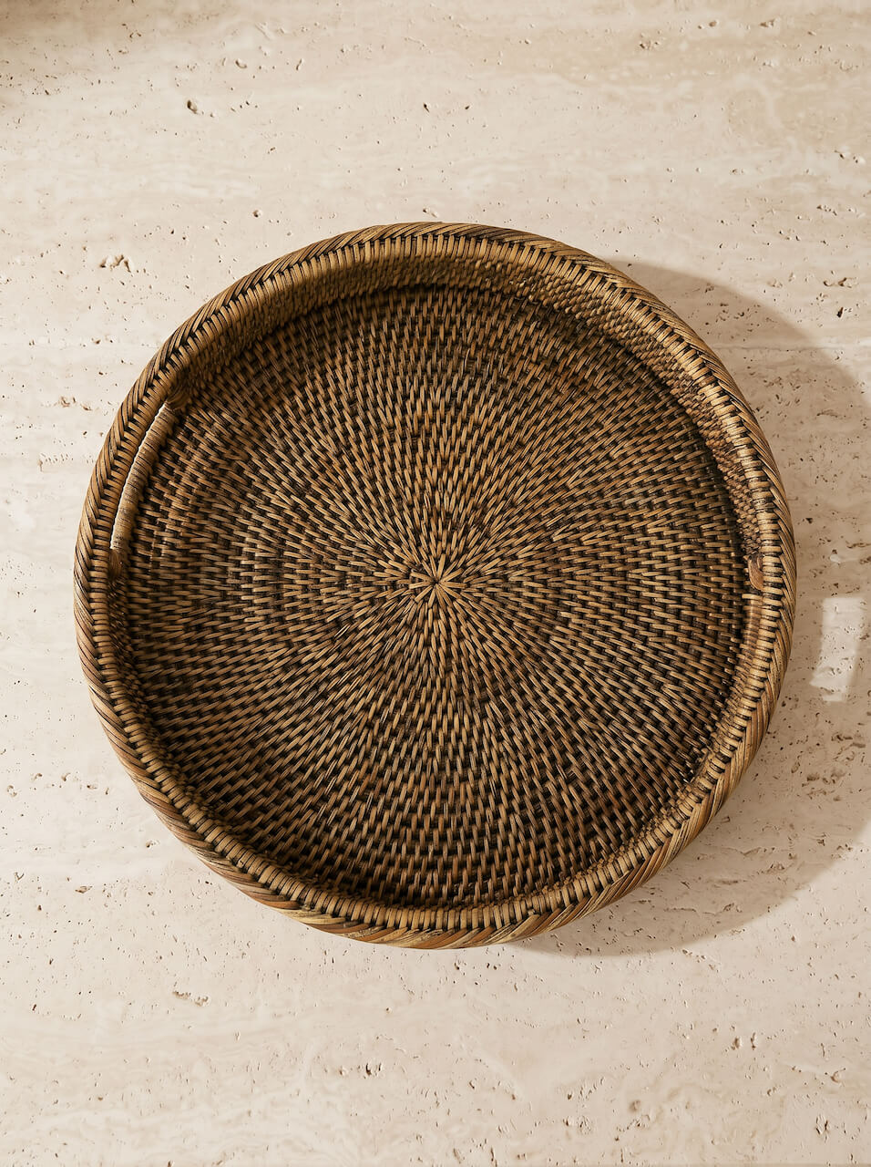 Antique brown rattan tray styled from above